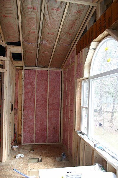 Picture 014.jpg - The bath where the shower will go. Holes in the floor are where the tub will go.